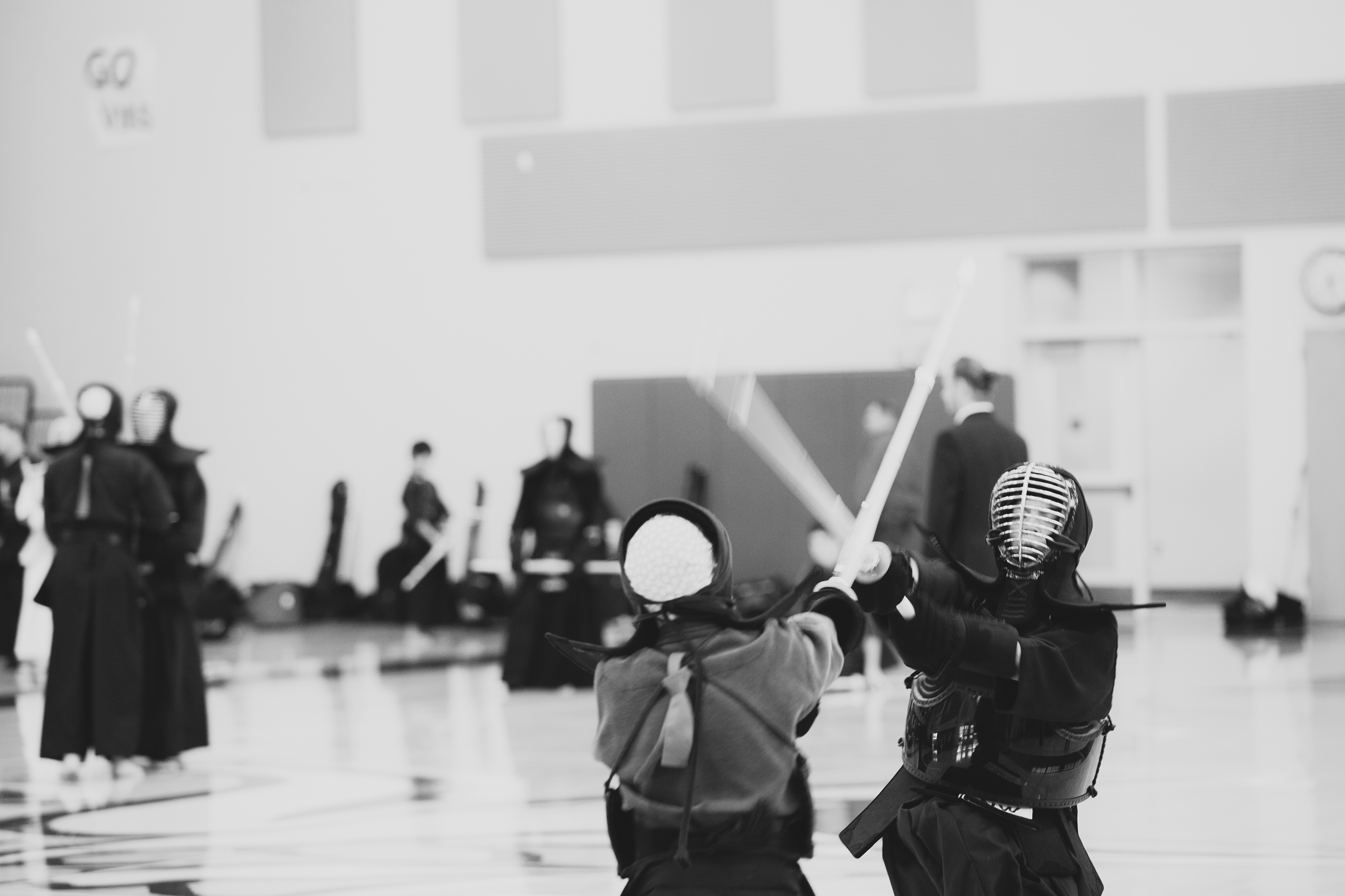 Kendo practitioners training in a gym during practice